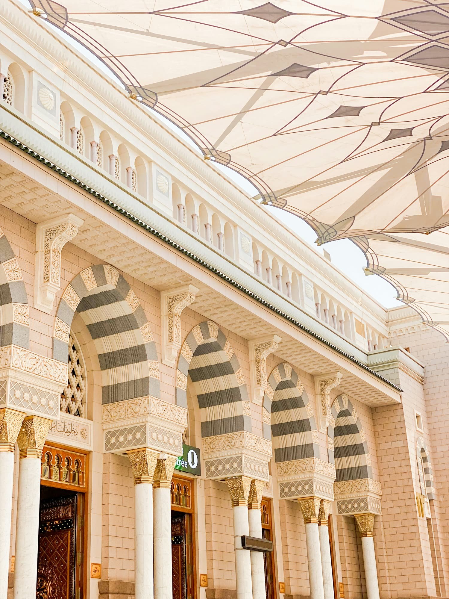 The facade and umbrellas of Masjid an-Nabawi