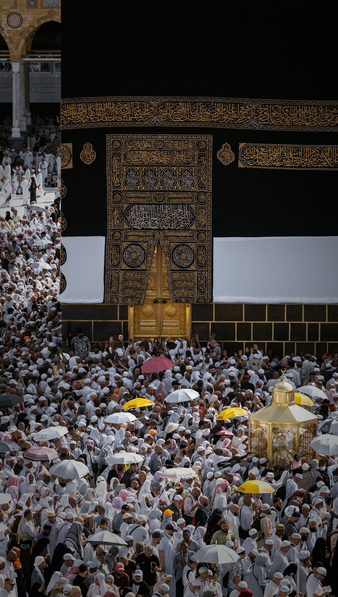 Pilgrims gathered at the door of the Kaaba